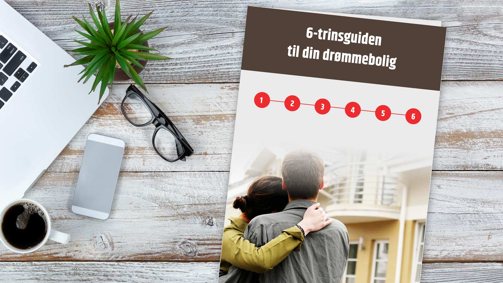 En 6 trins guide til køb af bolig ligger på et plankebord